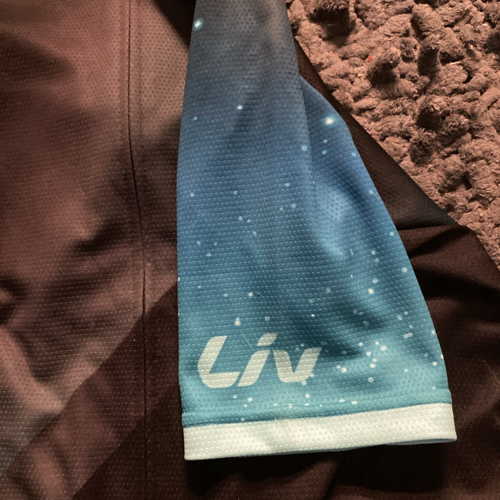 Liv Cycling Women’s Cycling Jersey Large, & Medium Bib Set, Black W/ Blue Galaxy