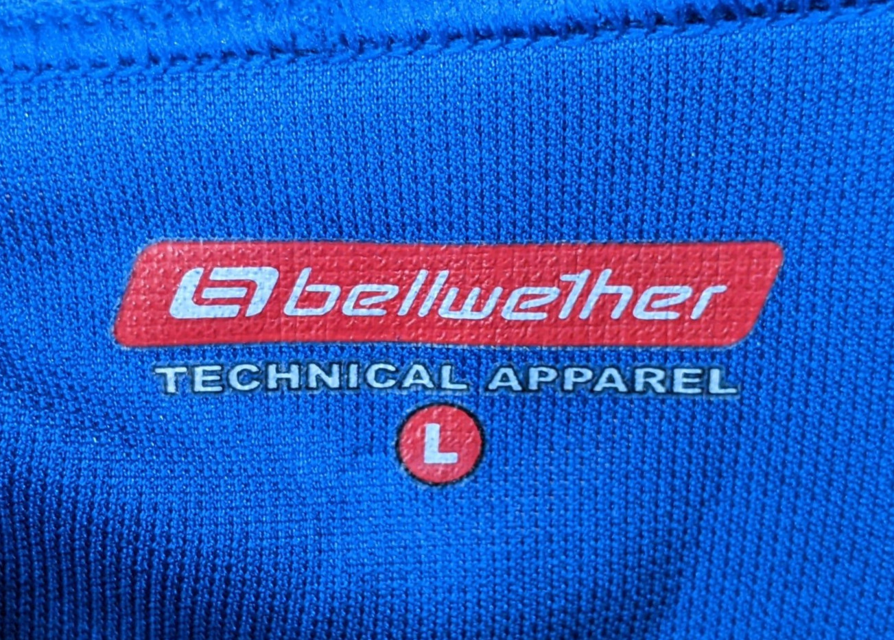 Bellwether Cycling Jersey Mens Large 1/2 Zip Blue Rear Pockets 100% Polyester