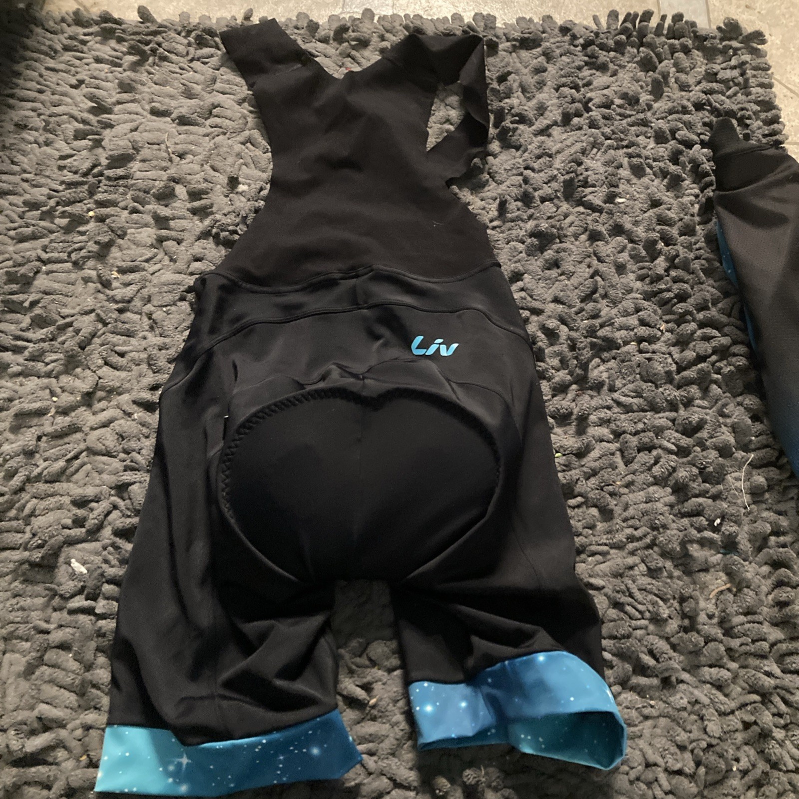 Liv Cycling Women’s Cycling Jersey Large, & Medium Bib Set, Black W/ Blue Galaxy