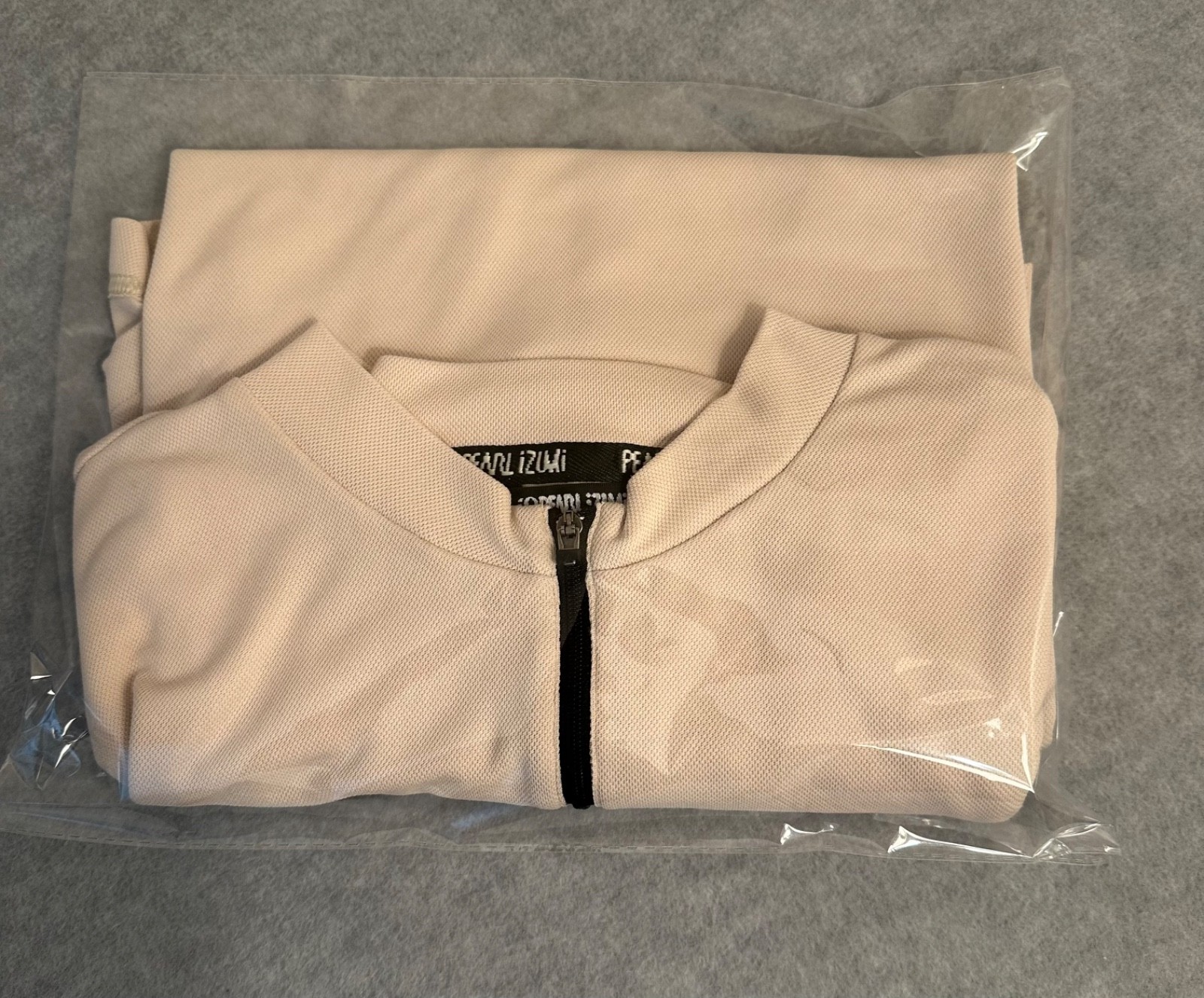 Pearl Izumi Men’s M Cycling Jersey tan/black 1/4 zip up back storage pocket