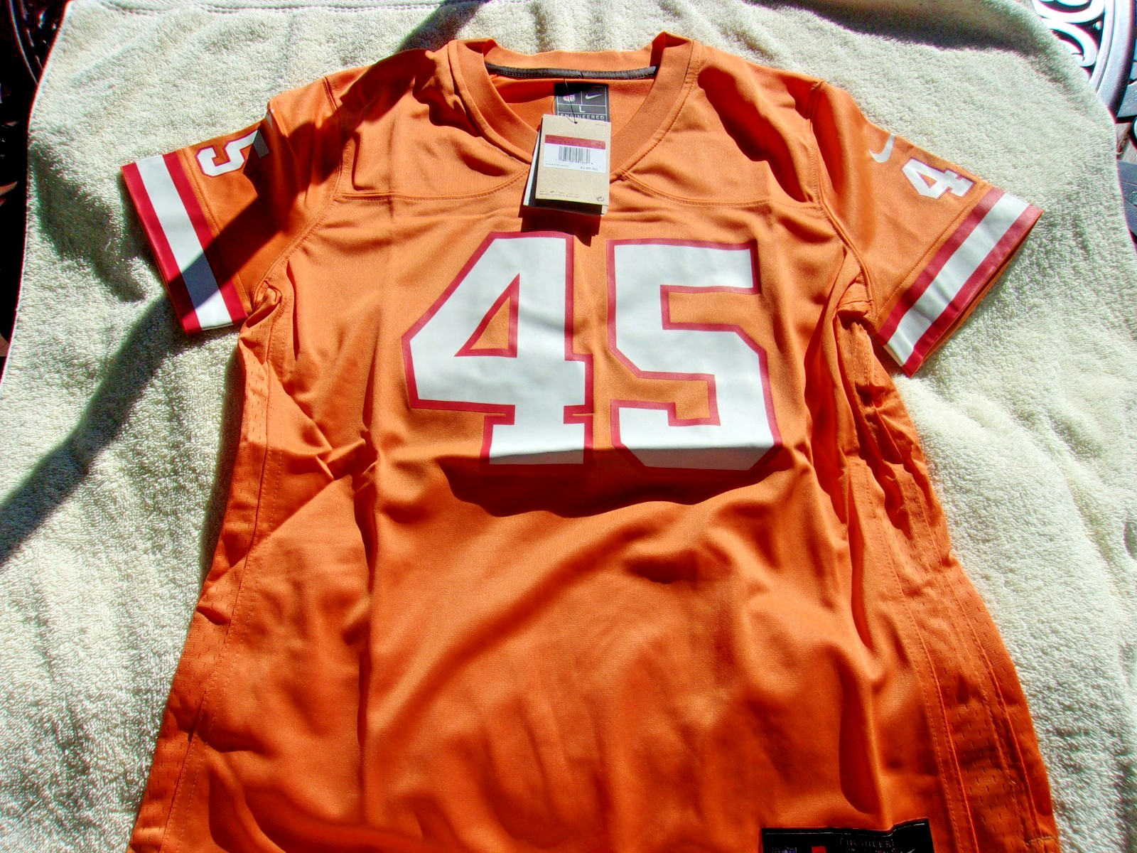 NWT Nike women’s size S, M, L football jersey, Tampa Bay, #45, orange, $130