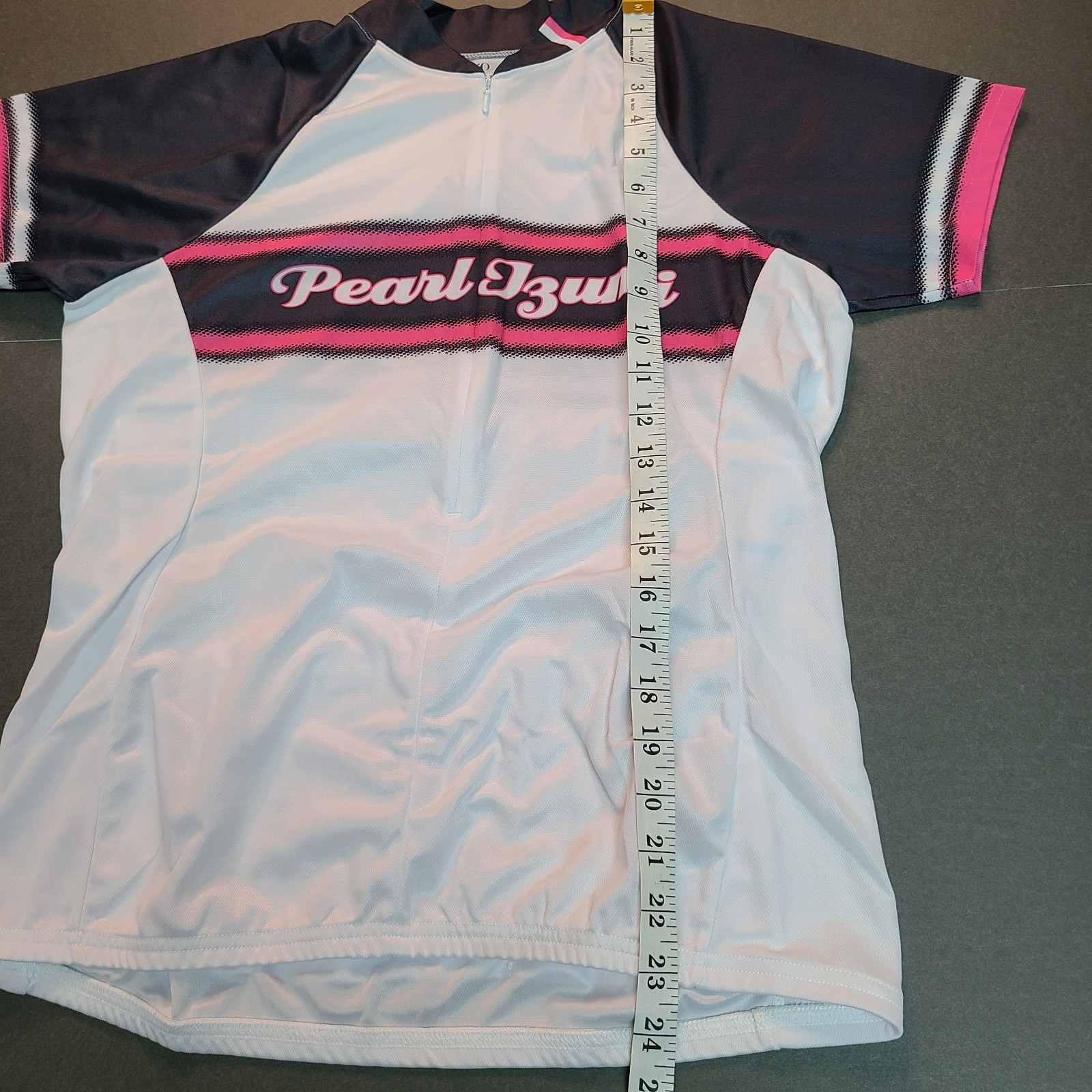 Women’s Pearl Izumi Cycling Jersey Size L White Spell Out SS Pockets 3/4 zip