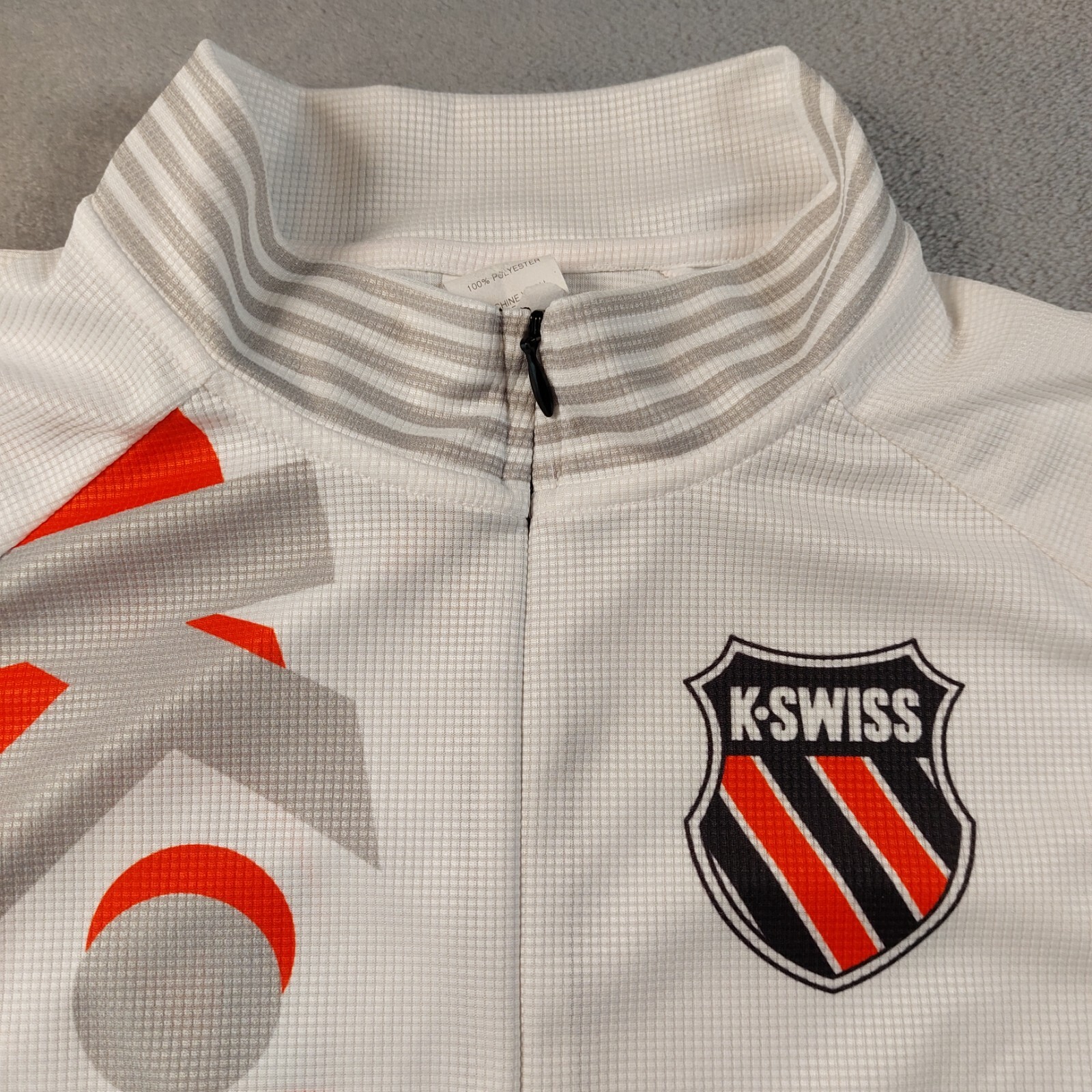 K-Swiss Cycling Jersey Men’s Size Large Pockets on back, Flaw/Stain on shoulder