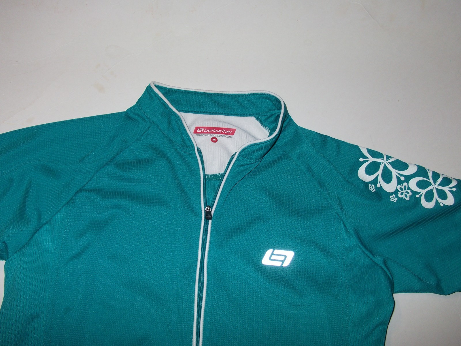 Bellwether shirt Women’s Cycling Jersey Med Cadence Teal Green White Floral Zip