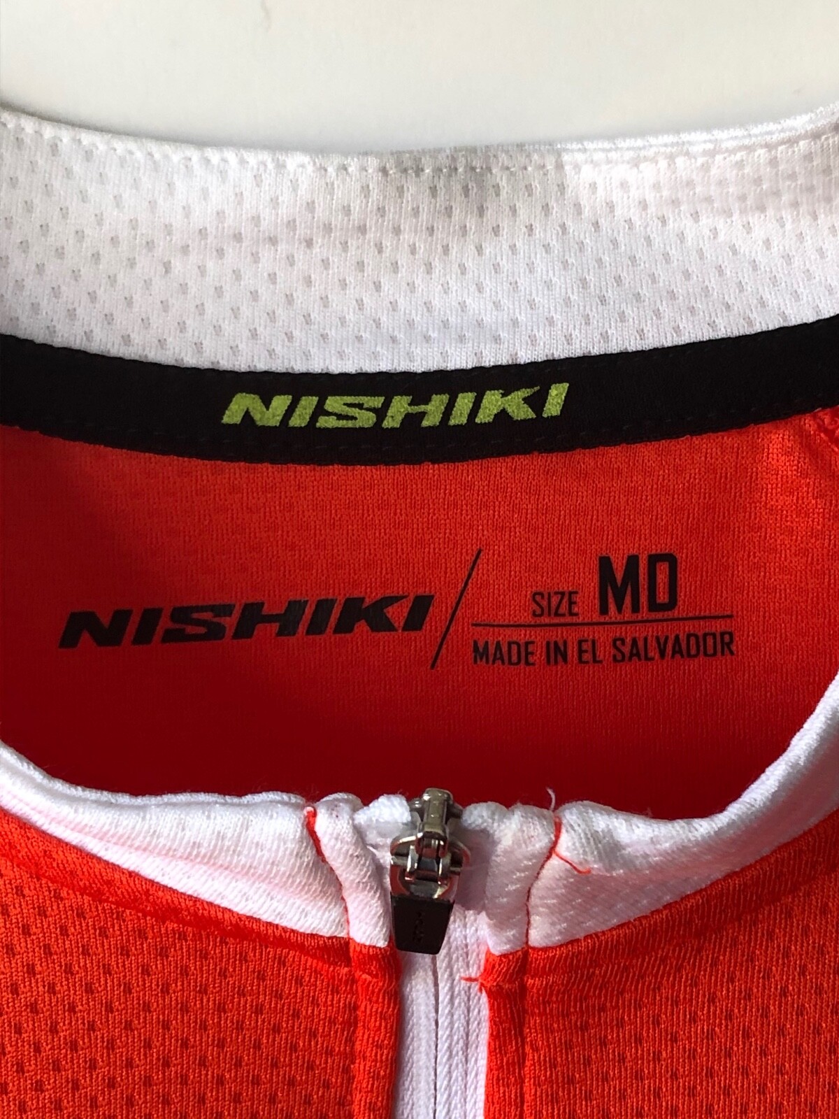 Nishiki mens orange & white cycling jersey elasticated waist 3 pockets US size M