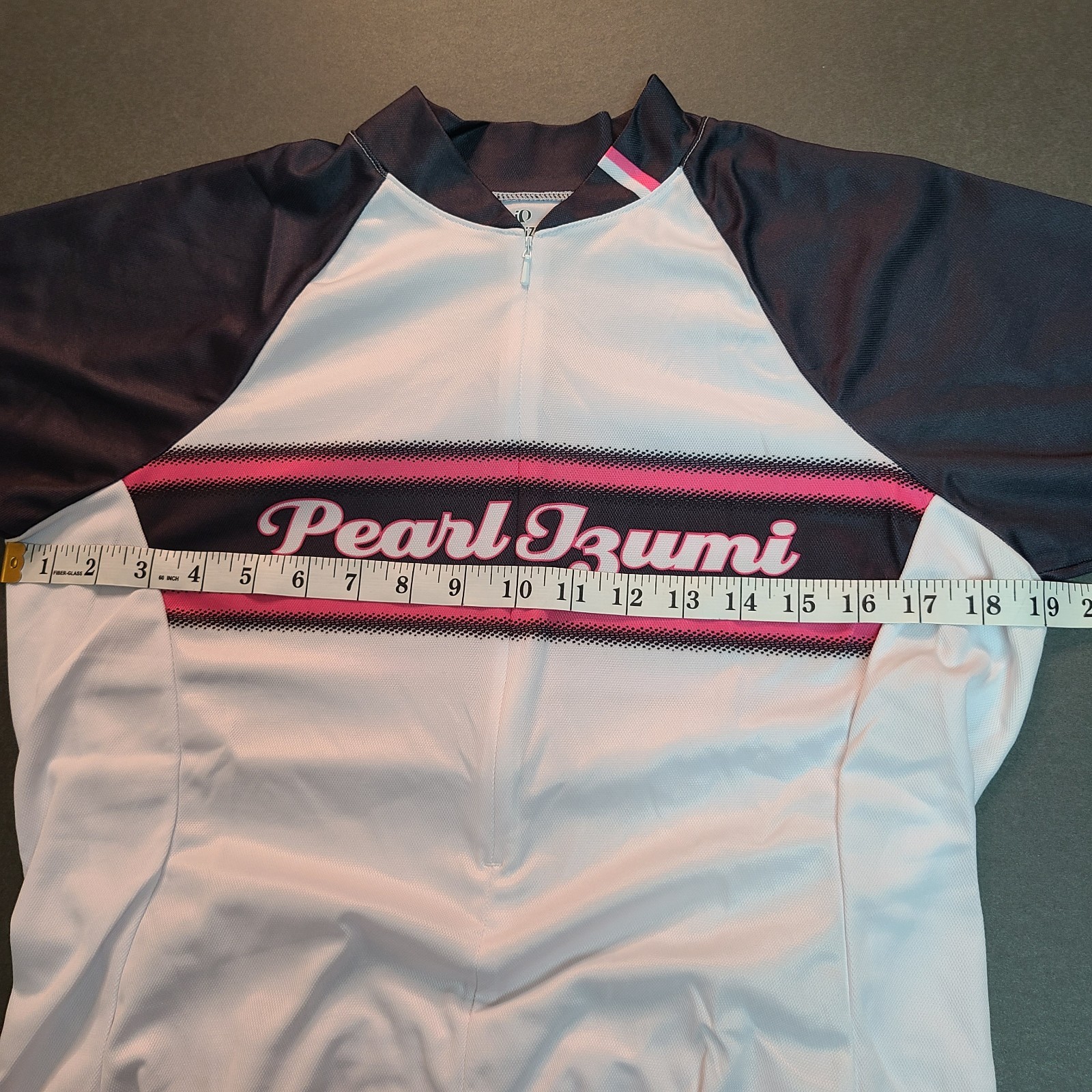 Women’s Pearl Izumi Cycling Jersey Size L White Spell Out SS Pockets 3/4 zip