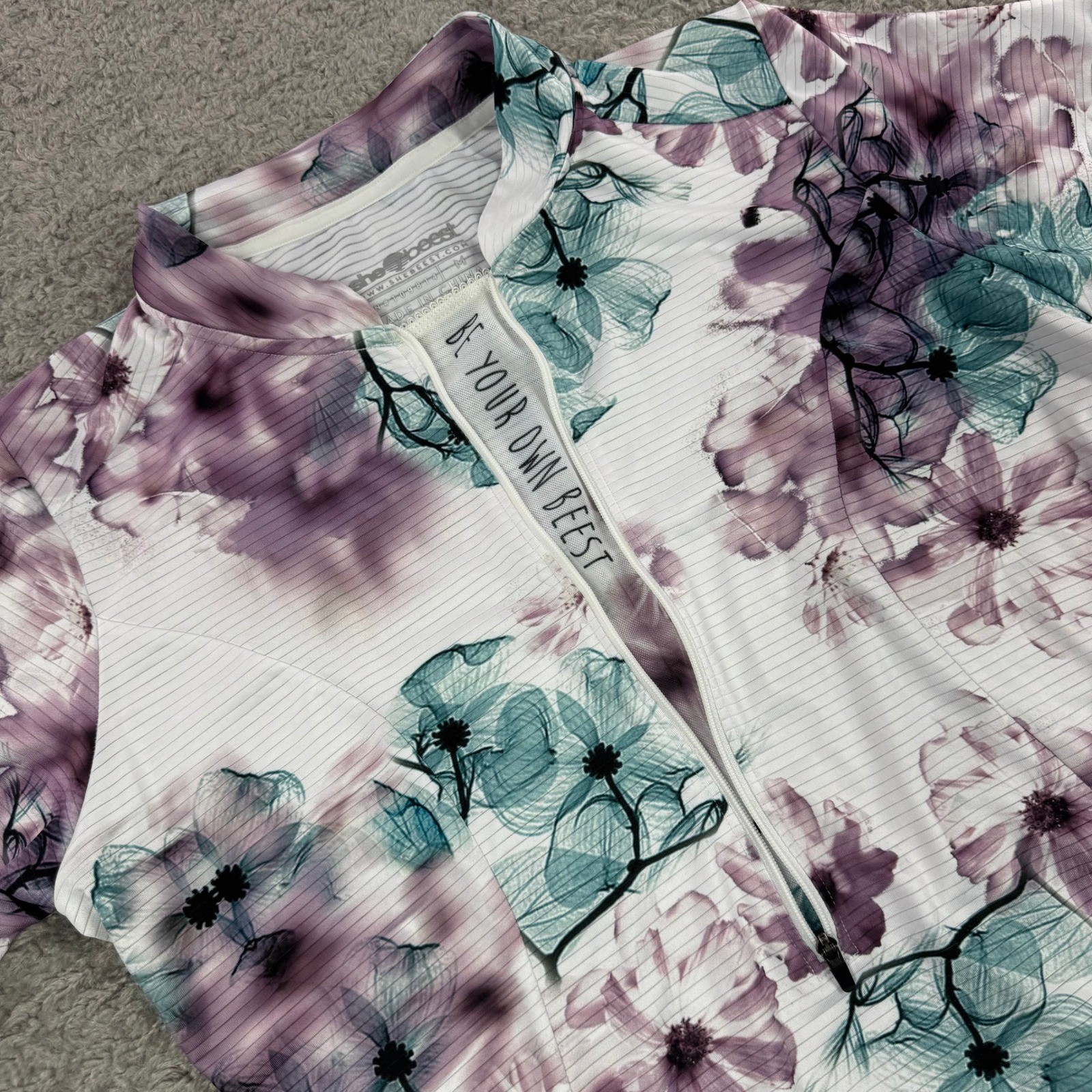 Shebeest Womens Floral Cycling Jersey White Purple Teal Short Sleeve Half Zip M