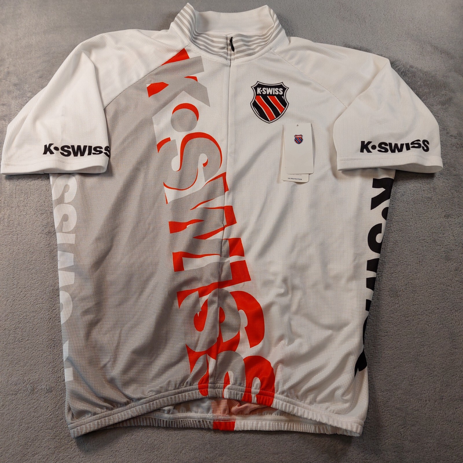 K-Swiss Cycling Jersey Men’s Size Large Pockets on back, Flaw/Stain on shoulder