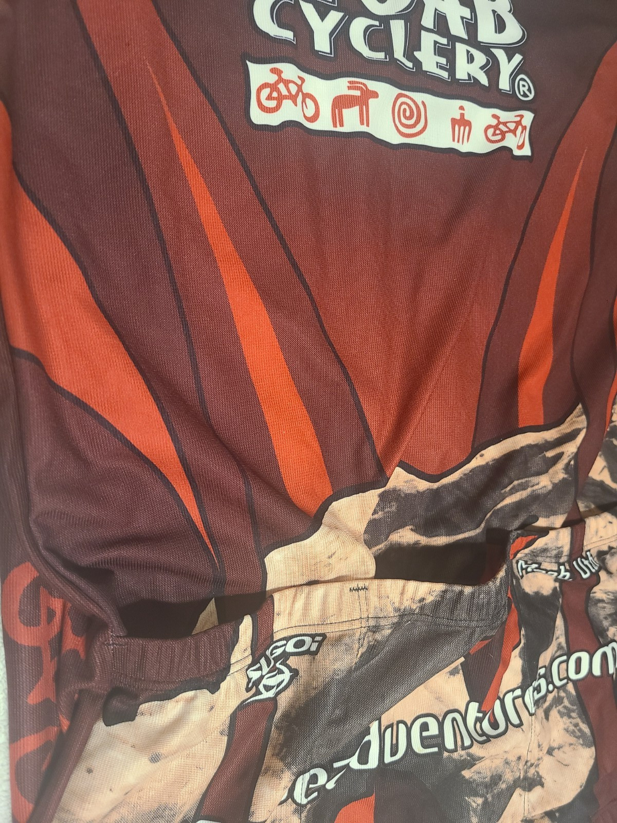 SUGOI Moab Cyclery Short Sleeve Multi-Color 3/4 Zipper Cycling Jersey – Men XL