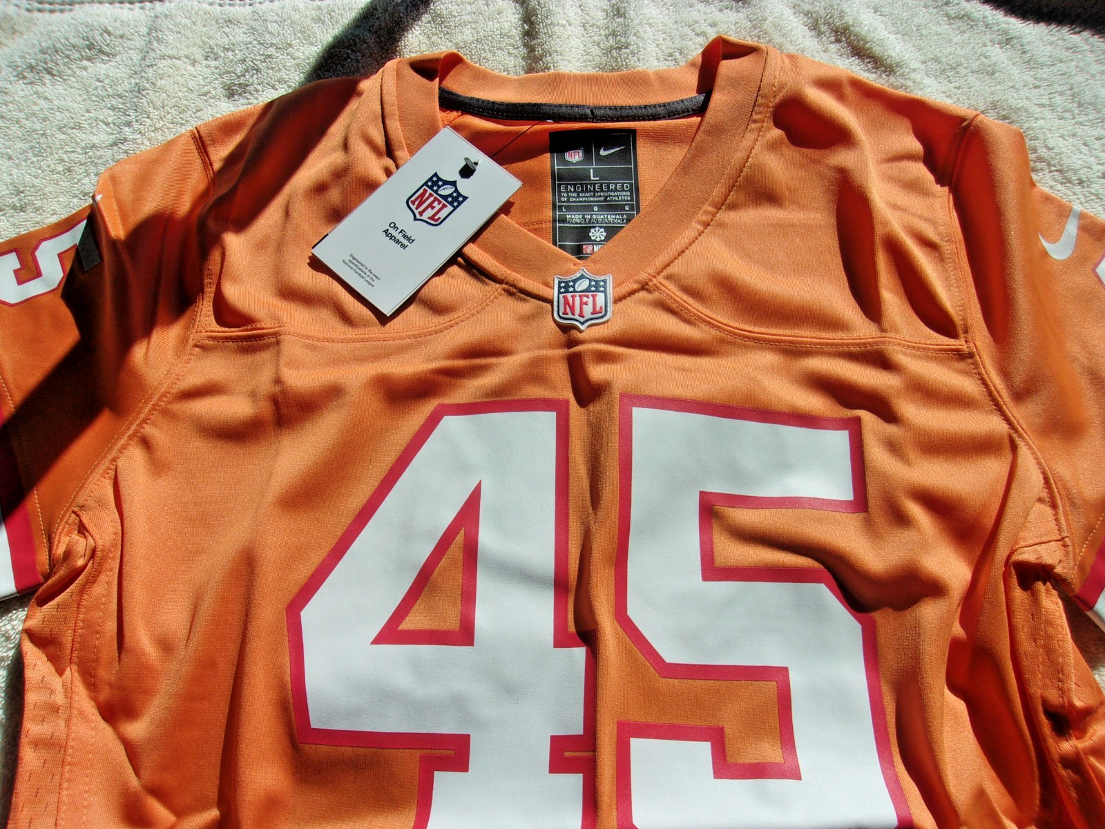 NWT Nike women’s size S, M, L football jersey, Tampa Bay, #45, orange, $130